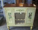 Very pretty decorated wine cabinet. Would make a great addition to your home and priced right at $95.00