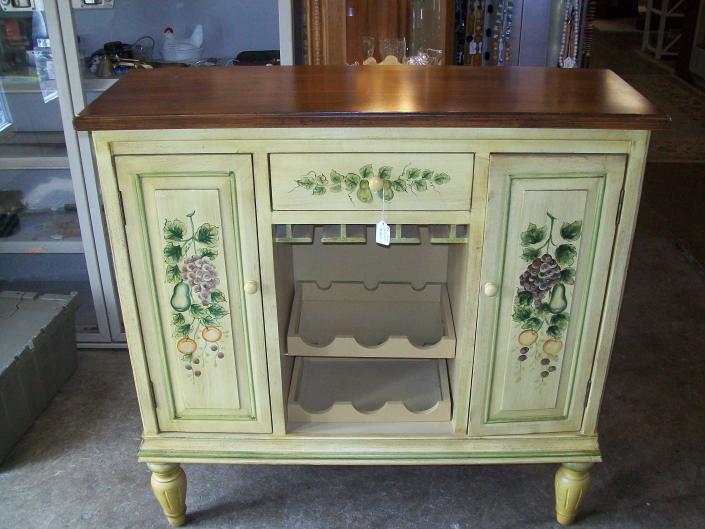 Very pretty decorated wine cabinet. Would make a great addition to your home and priced right at $95.00