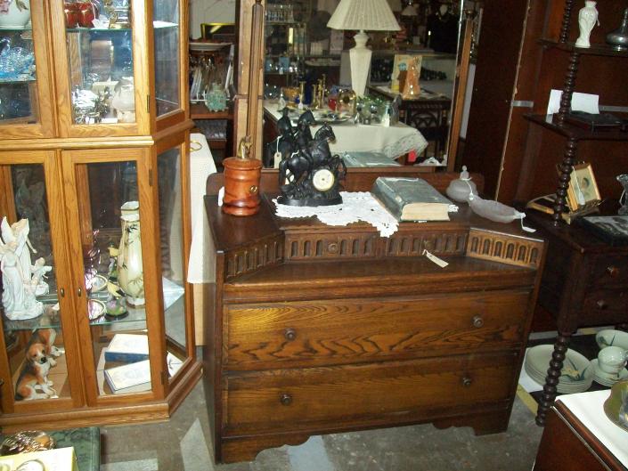 Mid Century with two small drawers and two large drawers.